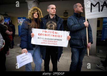 Family and supporters are seen rallying in front of the Swedish embassy in Warsaw, Poland on 17 March, 2023. Mariusz Dworakowski, a 47 year old Polish man arrested in December 2021 by Sweidsh police is currently serving time in jail in Sweden. Family membes say Mariusz was in the wrong place at the wrong time and was forced to remain lying on the street in freezing cold temperatures after suffering physical abuse by police. His family is demanding financial compensation for permanent injuries suffered during the arrest. Swedish authorities deny any wrongdoing by police and say the Mariusz will Stock Photo