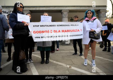 Family and supporters are seen rallying in front of the Swedish embassy in Warsaw, Poland on 17 March, 2023. Mariusz Dworakowski, a 47 year old Polish man arrested in December 2021 by Sweidsh police is currently serving time in jail in Sweden. Family membes say Mariusz was in the wrong place at the wrong time and was forced to remain lying on the street in freezing cold temperatures after suffering physical abuse by police. His family is demanding financial compensation for permanent injuries suffered during the arrest. Swedish authorities deny any wrongdoing by police and say the Mariusz will Stock Photo