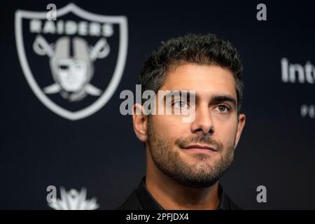 Las Vegas Raiders quarterback Jimmy Garoppolo (10) wipes away