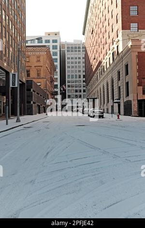 Vacant streets after a snowfall on February 25, 2023 in downtown Cleveland, Ohio.  East 12th, looking south towards Euclid Avenue, is covered in snow. Stock Photo