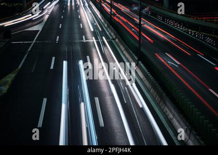 Light trails of car headlights and taillights. Driving cars captured with long exposure Stock Photo