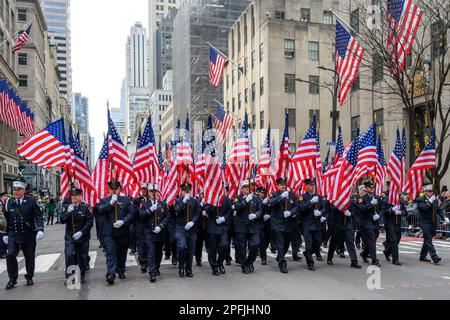 New York, USA. 17th Mar, 2023. 343 members of the US Fire Department carry flags in honor of the 343 firemen who died in the September 11 attack, as they march during St. Patrick's Day parade on March 17, 2023 in New York City. About 150,000 people march through Fifth Avenue every year in the largest the St. Patrick's Day Parade, who has been held annually since 1762 to celebrate Irish heritage. Credit: Enrique Shore/Alamy Live News Stock Photo