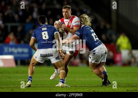 St Helens’ Matty Lees (centre) is tackled by Hull FC’s Ligi Sao (left) and Hull FC’s Brad Fash during the Betfred Super League match at the Totally Wicked Stadium, St Helens. Picture date: Friday March 17, 2023. Stock Photo