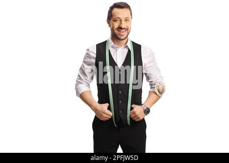 Young male tailor with a measuring tape smiling at camera isolated on white background Stock Photo