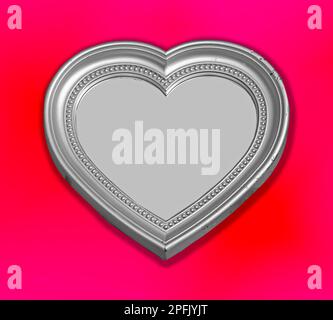Heart shaped silver metal plate isolated on pink background Stock Photo
