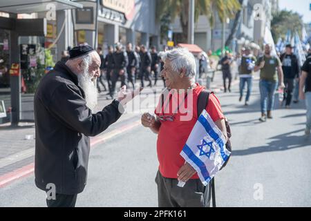 Bnei Brak, Israel. 16th Mar, 2023. Israeli reserve soldier against the reform speak with an Orthodox man during the demonstration. The soldiers opened a “recruiting centre” to IDF military service in a protestation act against the judicial overhaul in the Ultra-Orthodox city of Bnei Brak. Credit: SOPA Images Limited/Alamy Live News Stock Photo