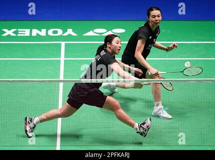 Korea's Kim So Yeong and Kong Hee Yong (left) in action against China's Chen Qing Chen and Jia Yi Fan (not pictured) during day four of the YONEX All England Open Badminton Championships at the Utilita Arena Birmingham. Picture date: Friday March 17, 2023. Stock Photo