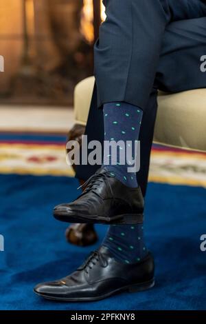 Washington, United States Of America. 17th Mar, 2023. Washington, United States of America. 17 March, 2023. U.S President Joe Biden, wearing shamrock socks, during the traditional St. Patrick's Day visit with Irish Taoiseach Leo Varadkar at the Oval Office of the White House, March 17, 2023 in Washington, DC Credit: Cameron Smith/White House Photo/Alamy Live News Stock Photo