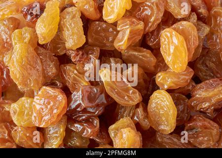 pile of prunes, european golden yellow color dried plums, close-up of popular snack and ingredient in many cuisines, full frame food background Stock Photo