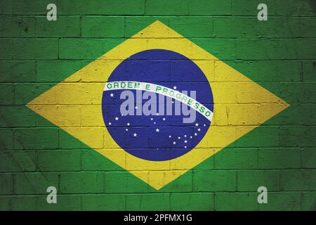 Flag of Brazil painted on a cinder block wall. Stock Photo