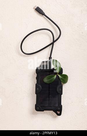 cheapest source of electricity. power box, portable solar battery for phone on white background. innovative solutions concept. copy space  Stock Photo