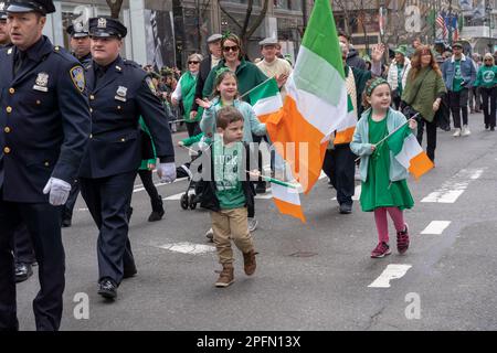 New York, United States. 17th Mar, 2023. Children of NY Port Authority Police Officers march in the St. Patrick's Day Parade along 5th Avenue in New York City. Credit: SOPA Images Limited/Alamy Live News Stock Photo