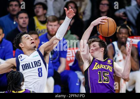 Los Angeles, California, USA. 17th Mar, 2023. Los Angeles Lakers guard Austin Reaves (R) grabs a rebound against Dallas Mavericks guard Josh Green (L) during an NBA basketball game at Crypto.com Arena, Friday, March 17, 2023, in Los Angeles. (Credit Image: © Ringo Chiu/ZUMA Press Wire) EDITORIAL USAGE ONLY! Not for Commercial USAGE! Stock Photo