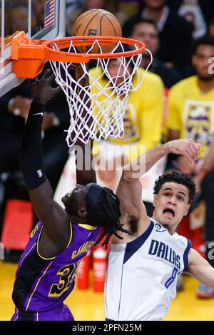 Los Angeles, California, USA. 17th Mar, 2023. Los Angeles Lakers forward Wenyen Gabriel (L) goes to the basket under pressure from Dallas Mavericks guard Josh Green (R) during an NBA basketball game at Crypto.com Arena, Friday, March 17, 2023, in Los Angeles. (Credit Image: © Ringo Chiu/ZUMA Press Wire) EDITORIAL USAGE ONLY! Not for Commercial USAGE! Stock Photo