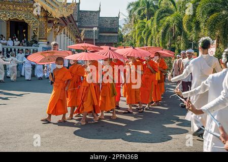 Monks and fingernail dancers, Funeral Procession from Wat Phra Singh, Chiang Mai Thailand Stock Photo