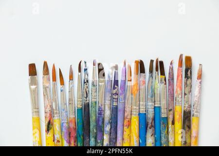 brushes in watercolor paint on an isolated background closeup ,hobby and creativity artist Stock Photo