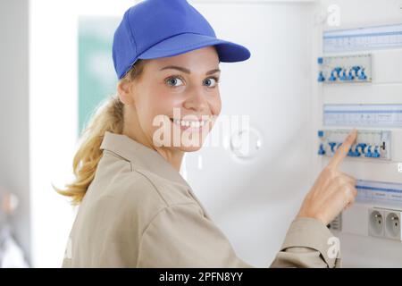 woman engineer inspecting electric counter equipment Stock Photo