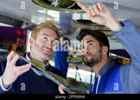 engine of the airplane under heavy maintenance Stock Photo