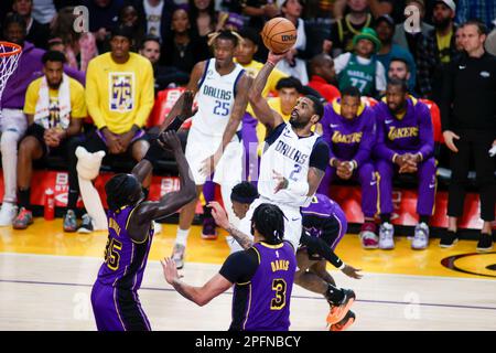 Los Angeles, United States. 17th Mar, 2023. Dallas Mavericks guard Kyrie Irving (R) shoots against the Los Angeles Lakers during an NBA basketball game at Crypto.com Arena in Los Angeles. Credit: SOPA Images Limited/Alamy Live News Stock Photo