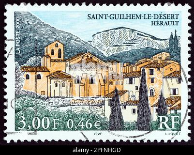 FRANCE - CIRCA 2000: A stamp printed in France shows Saint Guilhem le Desert, Herault, circa 2000. Stock Photo