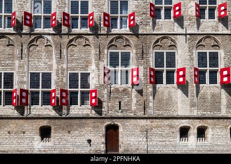 Side facade with windows and red shutters of the old Town Hall in the medieval city of Gouda. Stock Photo