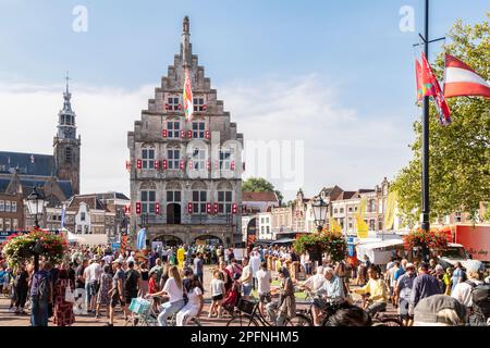 Pleasant bustle at the cheese market during the celebration of the city's 750th anniversary. Market square with a view of the old town hall and the Si Stock Photo