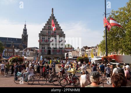 Pleasant bustle at the cheese market during the celebration of the city's 750th anniversary. Market square with a view of the old town hall and the Si Stock Photo