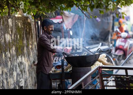 Rishikesh, Uttarakhand, India - October 2022: Street Vendor, Portrait of an unidentified street vendor preparing popcorn on the street of rishikesh. Stock Photo