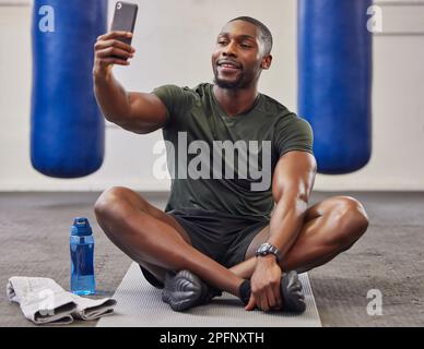 Gym, flexing or happy black woman taking selfie on workout, exercise or  training break on social media. Wellness, smile or healthy African girl  relaxing or taking pictures for online fitness content Stock