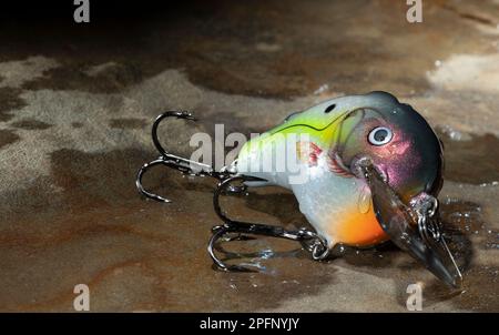 three red, orange, and yellow single hook fishing lures