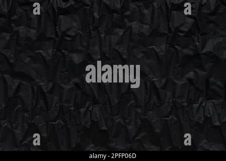 black crumpeled wrapping rough paper pattern for background Stock Photo