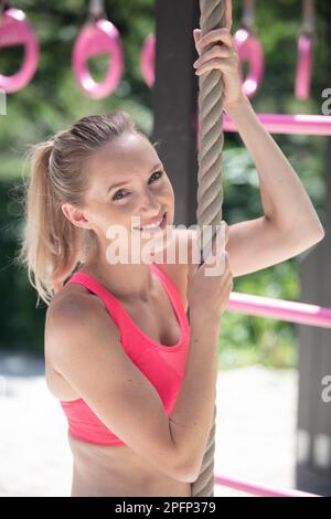 fitness rope climb exercise in fitness gym workout Stock Photo