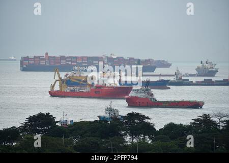 Marina Bay, Singapore - February 19, 2023 - The view of the cargo ships during the day Stock Photo