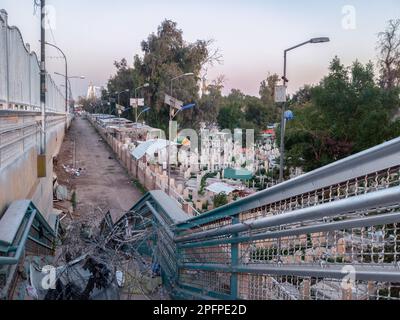 Baghdad, Iraq - Feb 28, 2023: Landscape Wide View of Al-Shuhadaa Cemetery Overlooking Tigris River in Adhamiya City, in which Martyrs of Civil War are Stock Photo