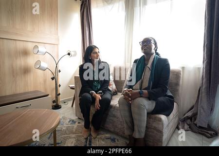 Home Secretary Suella Braverman (left) visits a newly built house with Minister for Information, Communication and technology, Claudette Irere on the outskirts of Kigali in Rwanda where accommodation is being constructed that could eventually house deported migrants from the UK. Picture date: Saturday March 18, 2023. Stock Photo