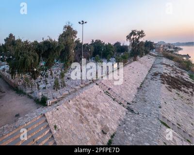 Baghdad, Iraq - Feb 28, 2023: Landscape Ultra Wide View of Al-Shuhadaa Cemetery Overlooking Tigris River in Adhamiya City, in which Martyrs of Civil W Stock Photo