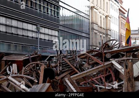 Berlin, Germany. 18th Mar, 2023. View of the installation of a barricade on the corner of Jägerstraße and Friedrichstraße during the Berlin Weekend for Democracy on the 175th anniversary of the March Revolution of 1848. This is the spot where the barricade fights broke out on March 18, 1848. Credit: Carsten Koall/dpa/Alamy Live News Stock Photo