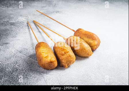Homemade deep fried corn dogs. White background. Top view. Stock Photo