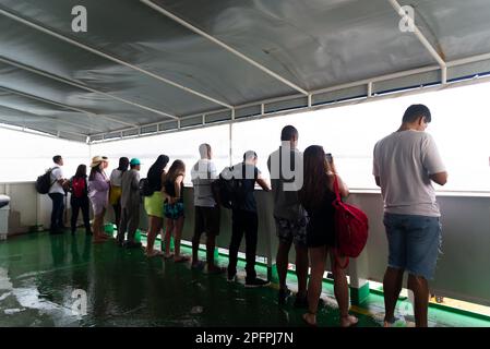 Salvador, Bahia, Brazil - September 09, 2022: Passengers inside the ferry boat enjoying the ocean scenery of Salvador, Bahia. Stock Photo