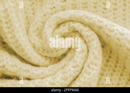 Texture of knitted woolen yellow cloth. Winter sweater background Stock Photo