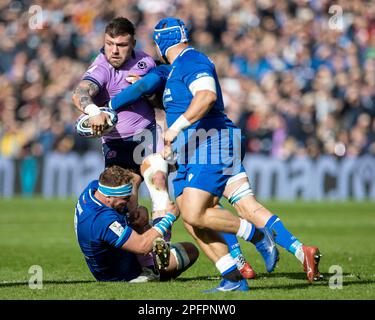 Edinburgh, UK. 18th Mar, 2023. 18th March 2023; Murrayfield Stadium, Edinburgh, Scotland: Six Nations International Rugby, Scotland versus Italy; Rory Sutherlans of Scotland is tackled Credit: Action Plus Sports Images/Alamy Live News Stock Photo