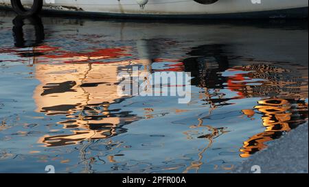 boatreflection on harbor Stock Photo