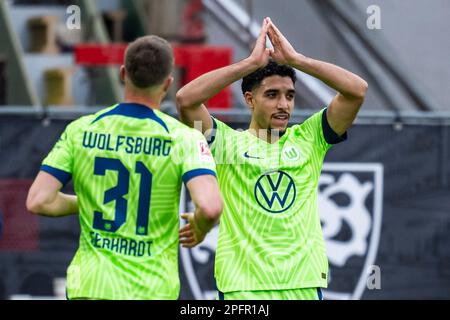 Stuttgart, Germany. 18th Mar, 2023. Soccer: Bundesliga, VfB Stuttgart - VfL Wolfsburg, Matchday 25, Mercedes-Benz Arena. Wolfsburg's Omar Marmoush (r) celebrates with Wolfsburg's Yannick Gerhardt (l) after scoring the 0:1 goal. Credit: Tom Weller/dpa - IMPORTANT NOTE: In accordance with the requirements of the DFL Deutsche Fußball Liga and the DFB Deutscher Fußball-Bund, it is prohibited to use or have used photographs taken in the stadium and/or of the match in the form of sequence pictures and/or video-like photo series./dpa/Alamy Live News Stock Photo