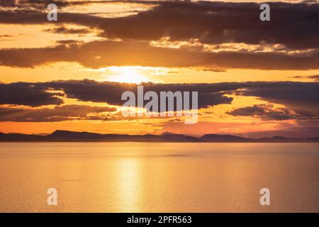 Sunset off Point Whitethorn, Washington State, USA -- view west toward the San Juan Islands in British Columbia, Canada Stock Photo