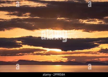 Sunset off Point Whitethorn, Washington State, USA -- view west toward the San Juan Islands in British Columbia, Canada Stock Photo