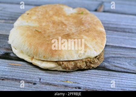 Egypt traditional pita bread in oven conveyor Industry Stock Photo - Alamy