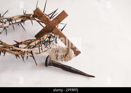 Crown of thorns, nails and cross on wooden table, closeup Stock Photo -  Alamy