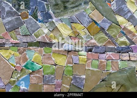 Mosaic panel from pieces of ceramic tiles, marble and granite. Abstract mosaic colored ceramic stones. Stock Photo