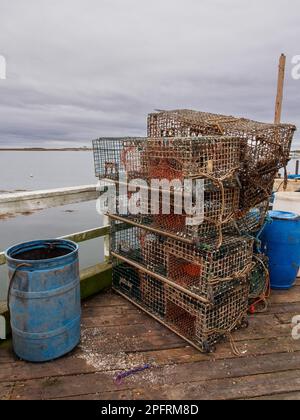 A lobster trap, lobster pot or lobster cage is a portable trap that traps lobsters or crayfish. Here in Kennebunkport, Maine, USA, by the Atlantic Oce Stock Photo