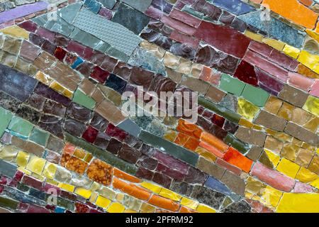 Mosaic panel from pieces of ceramic tiles, marble and granite. Abstract mosaic colored ceramic stones. Stock Photo